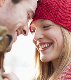 Man and woman smiling after Orange California teeth whitening