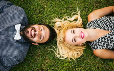 Man and woman smiling after a dental visit using sedation dentistry in Orange California