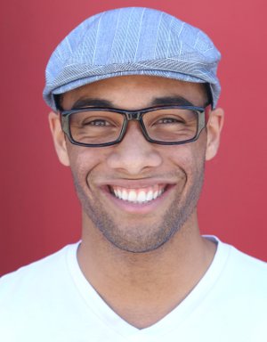 Man smiling after receiving dental crowns in Orange California