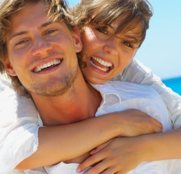 Man and woman with Lumineers in Orange California smiling