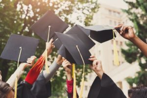 Graduates throwing their caps in the air