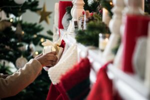 a person putting a present into a stocking