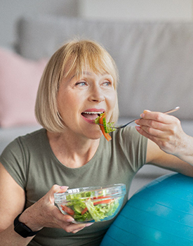Woman eating salad