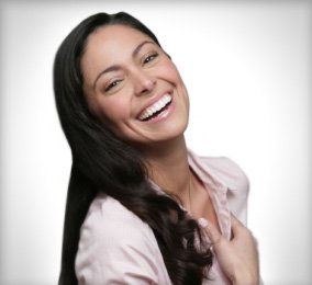 Patient with straightened smile after Invisalign clear braces in Orange California