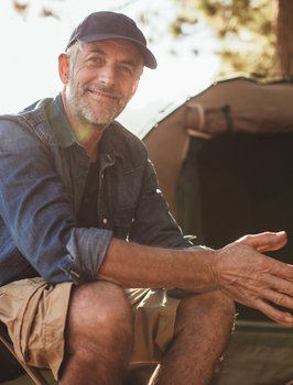 Man with full smile thanks to dental implants in Orange California