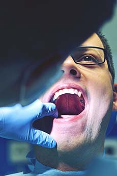man getting a dental exam