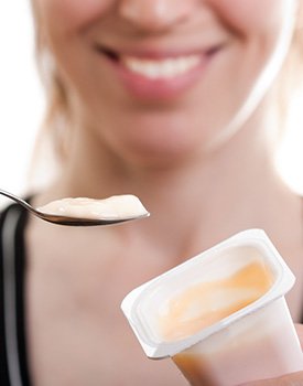woman eating pudding