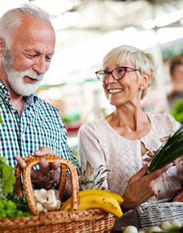 a mature couple shopping for healthy food