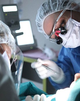 Dentists performing surgery