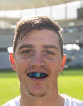 Man wears athletic mouthguard