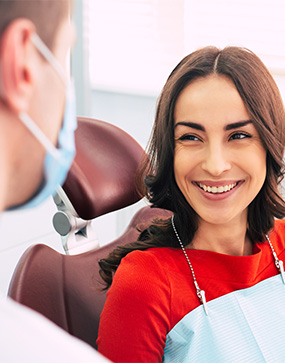Woman smiling at dentist during dental visit